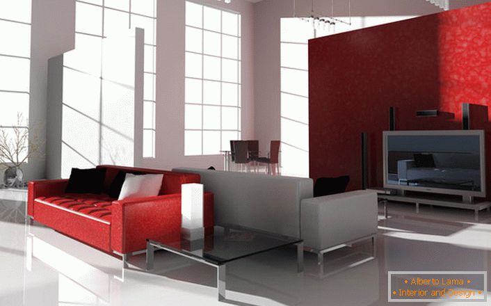 Il colore scarlatto contrastante in stile high-tech è interessante e richiesto. Il divano rosso brillante sulle gambe cromate è ideale per arredare interni moderni.
