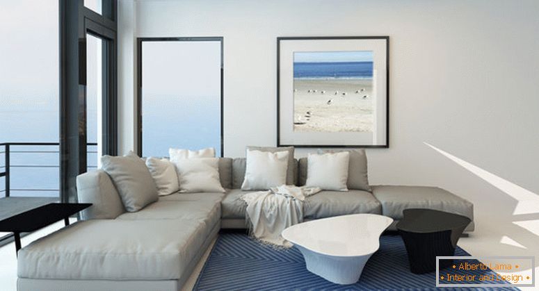 Salotto moderno sul lungomare con un luminoso salone arioso con una comoda e moderna suite rivestita di grigio, arte sul muro e una grande finestra panoramica lungo una parete che si affaccia sull'oceano