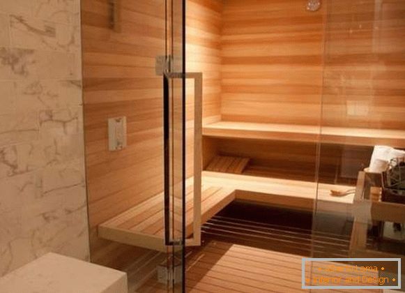 Raccordi cromati per porte in vetro nella sauna - maniglie delle porte