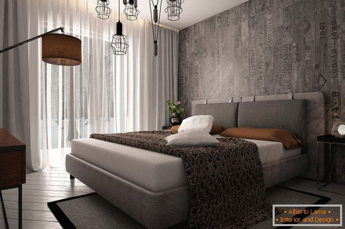 Un esempio di illuminazione ben scelta per una camera da letto in stile loft.