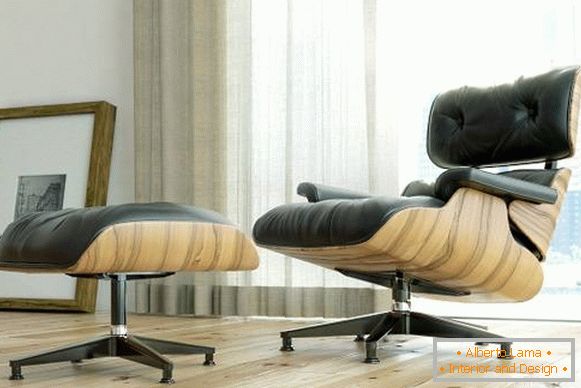 Black Eames lounge chair con supporto sotto i piedi