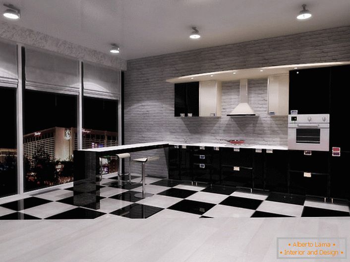 La cucina nello stile del minimalismo nel monolocale con finestre panoramiche è una scelta eccellente per chi ama lo spazio e la libertà di azione.