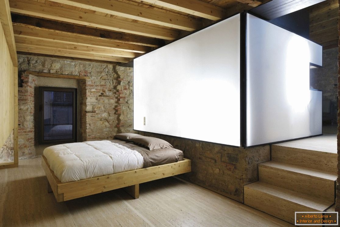 Camera da letto in una casa di legno a Brescia