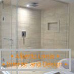 Box doccia con mattonelle di sabbia e porta bianca