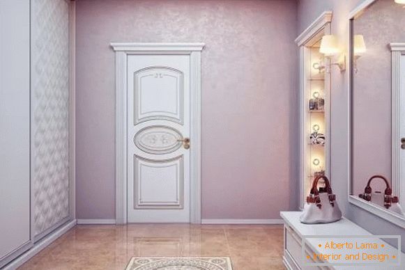 Progettazione di un ampio corridoio in una casa privata con un armadio a muro bianco