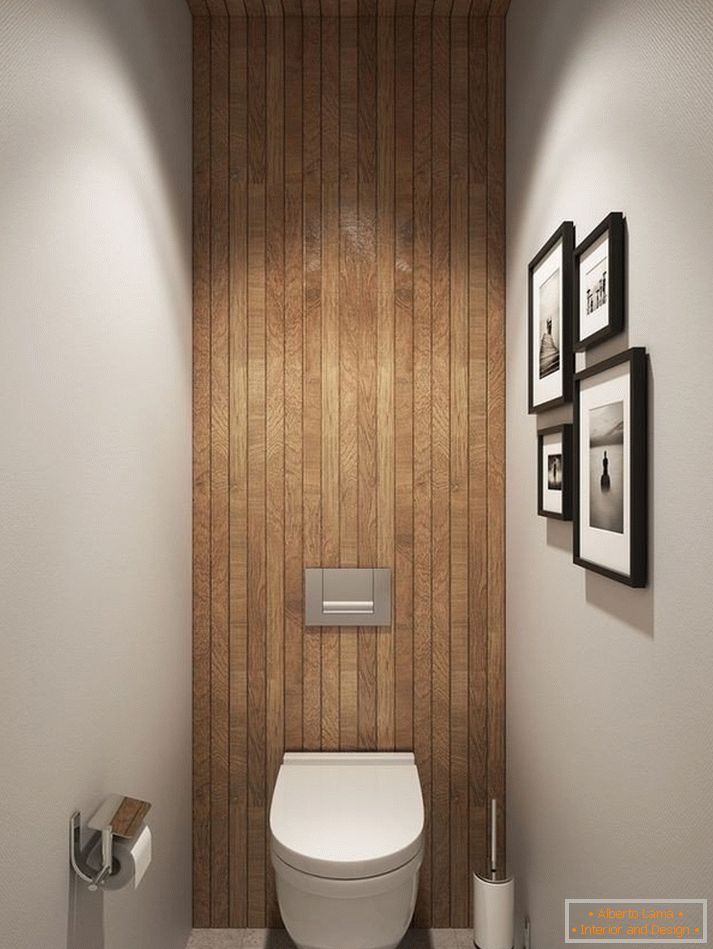 Un bagno con un soffitto in legno e un muro