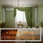 Camera da letto nei toni del verde, del beige e del bordeaux