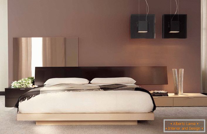 Un design minimalista con note di colore giapponese nella camera da letto di un normale appartamento francese. 