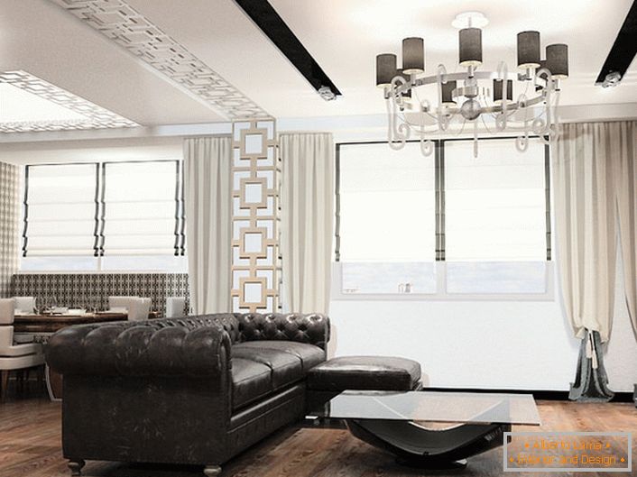 Arredamento in stile art deco è sempre mobili di grandi dimensioni. Ideale per arredare il soggiorno in questo concetto stilistico è un divano in pelle con imbottitura trapuntata.