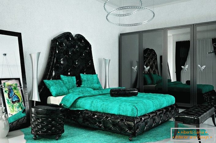 Colori accesi e accattivanti per lo stile art deco. Il colore smeraldo si abbina armoniosamente con il nero. Camera da letto ideale per una persona creativa.